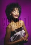 04-03-1985 Whitney Houston at studio in Amterdam, The Netherlands. March 04, 1985.

[keywords]Posed, Eye Contact, Smiling, Dress[/keywords]